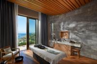 a bedroom with a bed and a sink and a window at Mandarin Oriental, Bodrum in Golturkbuku