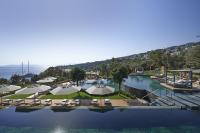 an overhead view of a pool with umbrellas and chairs at Mandarin Oriental, Bodrum in Golturkbuku