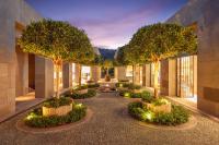 a courtyard with trees and lights in a building at Mandarin Oriental, Bodrum in Golturkbuku