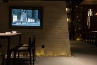 TV a/nebo společenská místnost v ubytování Jiayuguan Tuzhu Hotel