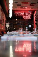 a dining room with a table with wine glasses at Look Living, Lisbon Design Apartments in Lisbon