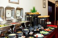 a buffet with many different types of food on a table at Lancaster Kumasi City in Kumasi