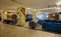 a lobby of a hotel with couches and chairs at Lancaster Kumasi City in Kumasi