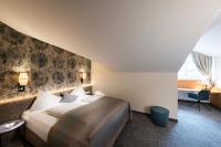 Łóżko lub łóżka w pokoju w obiekcie Hotel Königgut