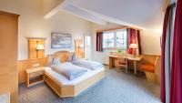 Łóżko lub łóżka w pokoju w obiekcie Hotel Königgut