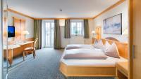 Łóżko lub łóżka w pokoju w obiekcie Hotel Königgut