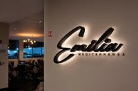 a sign for a restaurant on a wall at Radisson San Luis Potosi Aeropuerto in Santa Ana