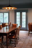a dining room with a wooden table and chairs at RT Lodge in Maryville
