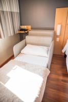 a room with two beds and a window at ibis Itu Plaza Shopping in Itu