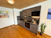 A kitchen or kitchenette at Alpenapart Singer - contactless check-in