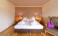 Łóżko lub łóżka w pokoju w obiekcie Hotel Walserwirt