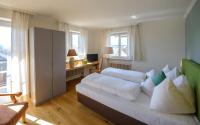 Łóżko lub łóżka w pokoju w obiekcie Hotel Walserwirt