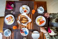 a wooden table with plates of food on it at Pothana Village in Sigiriya