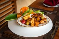a plate of food on top of a table at Pothana Village in Sigiriya