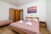 Posteľ alebo postele v izbe v ubytovaní Apartments MAJA