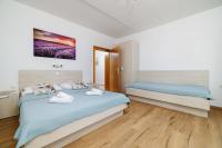 Posteľ alebo postele v izbe v ubytovaní Apartments MAJA
