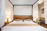 A bed or beds in a room at Vintagehome Schönbrunn