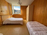 Posteľ alebo postele v izbe v ubytovaní Villa Prairie Mont-Dore 7 Appartements