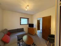 Televízia a/alebo spoločenská miestnosť v ubytovaní Villa Prairie Mont-Dore 7 Appartements