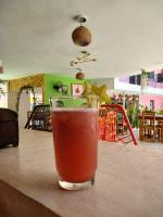 a drink sitting on top of a table at Hotel Don Luis in Valladolid