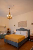 Posteľ alebo postele v izbe v ubytovaní Casa Santangelo Suites