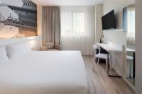 Postel nebo postele na pokoji v ubytování B&B HOTEL Valencia Ciudad de las Ciencias