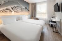 Postel nebo postele na pokoji v ubytování B&B HOTEL Valencia Ciudad de las Ciencias