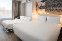 Postel nebo postele na pokoji v ubytování B&B HOTEL Valencia Ciudad de las Ciencias