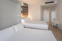 Postel nebo postele na pokoji v ubytování B&B HOTEL Valencia Ciudad de las Ciencias
