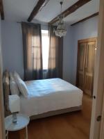 Posteľ alebo postele v izbe v ubytovaní Piazza Vittorio Suites