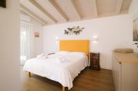 A bed or beds in a room at Agriturismo Resort Il Foionco