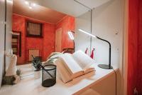 A bed or beds in a room at La Tela di Penelope