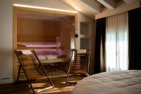 Łóżko lub łóżka w pokoju w obiekcie Hotel Villa I Pini