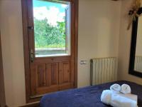 Postel nebo postele na pokoji v ubytování El Cajigar Ordesa Ainsa casa rural