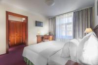 Łóżko lub łóżka w pokoju w obiekcie Hotel Lunik