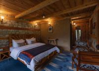 Kudrat - A Boutique Homestay- Tirthan Valleyにあるベッド