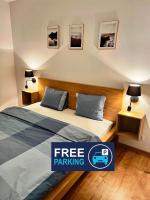 Posteľ alebo postele v izbe v ubytovaní Zielone Apartamenty Katowice Chorzów