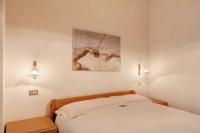 A bed or beds in a room at Baita Franz 2 Livigno