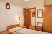 A bed or beds in a room at Baita Franz 2 Livigno