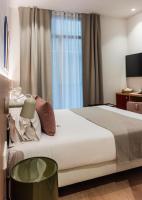 Postel nebo postele na pokoji v ubytování Hotel California
