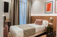 Postel nebo postele na pokoji v ubytování Hotel California
