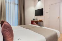 Postel nebo postele na pokoji v ubytování Hotel California