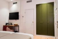 TV a/nebo společenská místnost v ubytování Hotel California