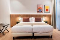 Postel nebo postele na pokoji v ubytování Hotel California