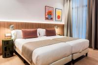 Postel nebo postele na pokoji v ubytování Hotel California