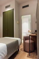 Postel nebo postele na pokoji v ubytování Hotel California