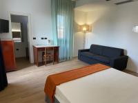 A bed or beds in a room at Hotel Sirena - B&B