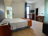 A bed or beds in a room at Hotel Sirena - B&B