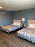 WoodSpring Suites Hermitage - Nashville Airportにあるベッド