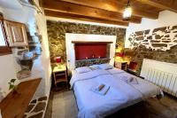 Posteľ alebo postele v izbe v ubytovaní Cinco Lunas VEGETARIAN Guesthouse